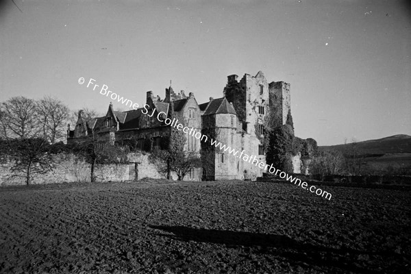 CARRICK CASTLE  VIEW FROM ORCHARD SHOWING OLD CASTLE AND ELIZABETHAN ADDITION